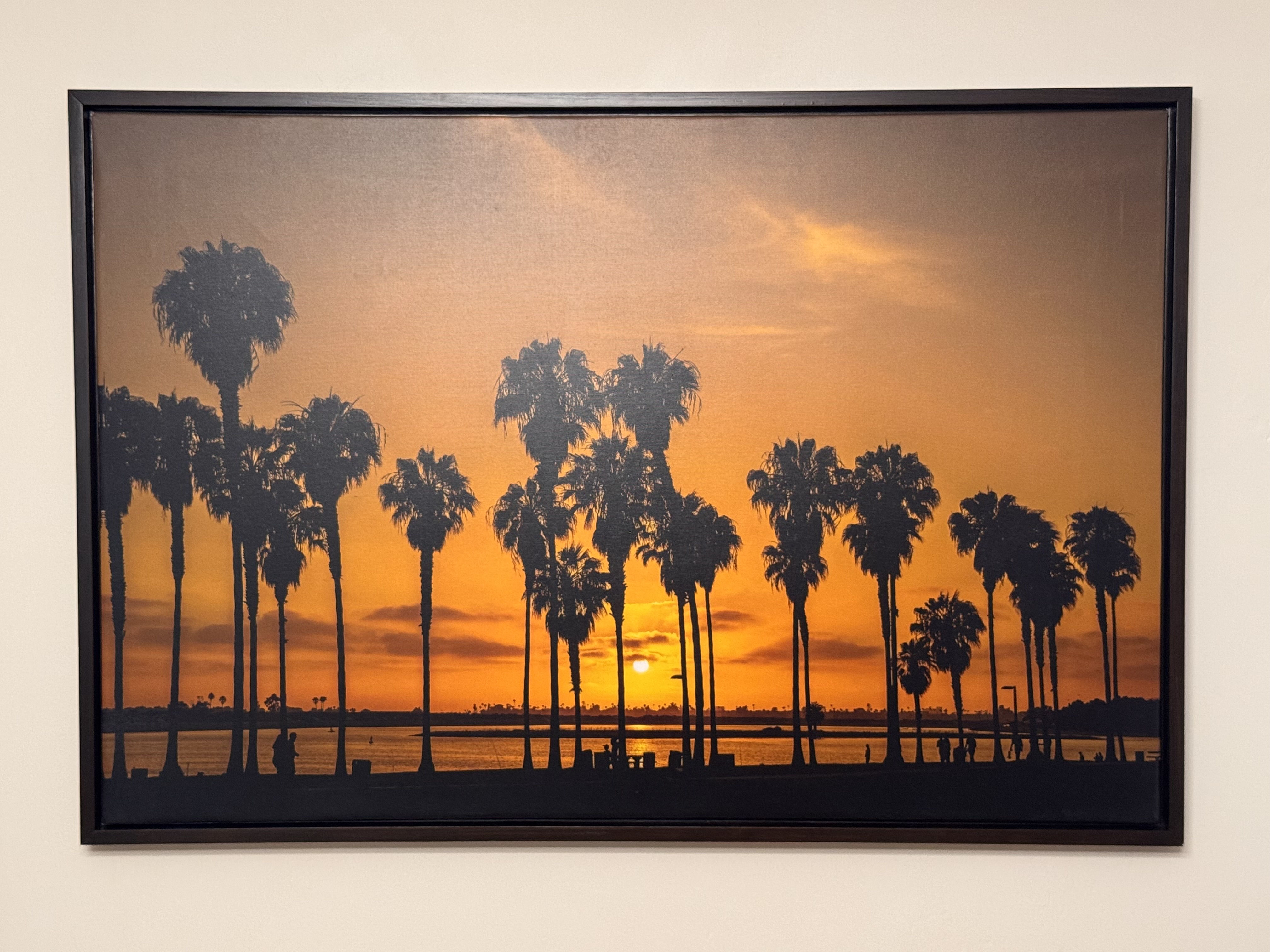 Floating canvas frame — black finish, sunset palms